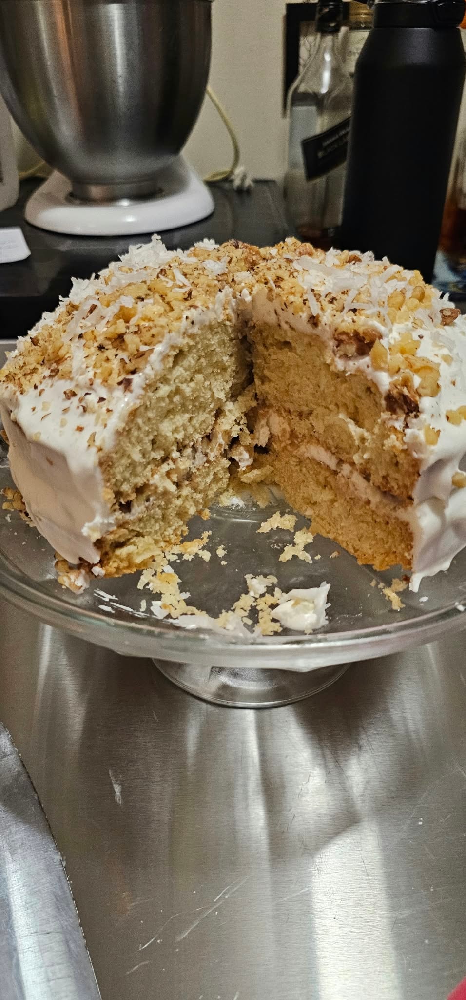Homemade Italian Cream Cake with toasted coconut and walnut topping