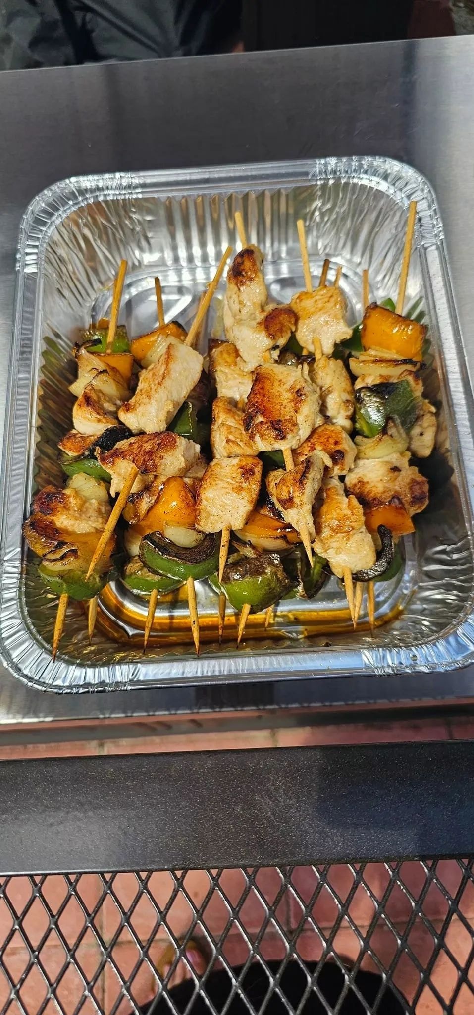 Grilled chicken and vegetable skewers with bell peppers and onions